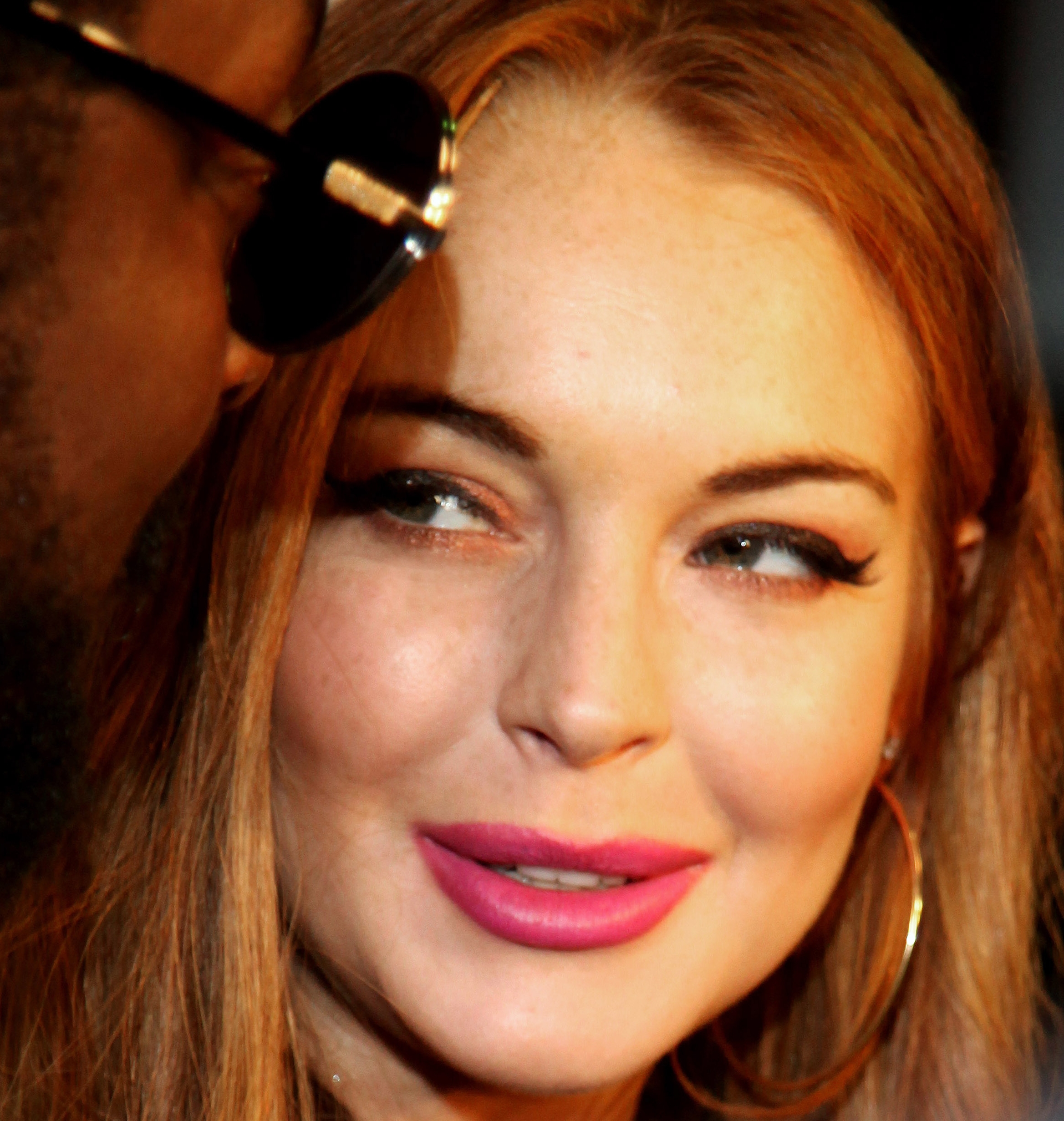 Lindsay Lohan completes 13th step, invents hangover cure